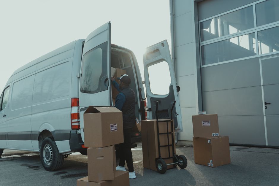 Long distance movers loading a large moving van